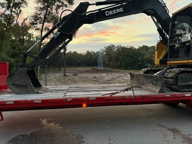 John Deere 333 compact track loader on grass